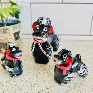 Vintage poodle with pups on chain. 50s mid century